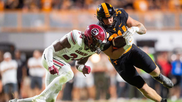 Tennessee tight end McCallan Castles (34) moves past South Carolina defensive back Jalon Kilgore (24) during a football game between Tennessee and South Carolina at Neyland Stadium in Knoxville, Tenn., on Saturday, Sept. 30, 2023.