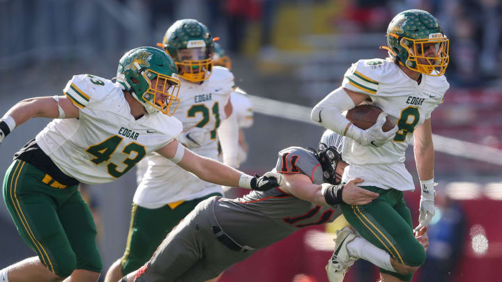 Edgar High School's Kohlbe Weisenberger (8) is tackled by Black Hawk/Warren's Eli Schliem (11) as he returns a fumble during the WIAA Division 7 state championship football game on Thursday, November 16, 2023, at Camp Randall Stadium in Madison, Wis. Edgar won the game, 36-6.
Tork Mason/USA TODAY NETWORK-Wisconsin