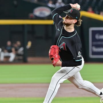 Aug 29, 2024; Phoenix, Arizona, USA;  Arizona Diamondbacks pitcher Ryne Nelson (19) throws in the first inning against the New York Mets at Chase Field. Mandatory Credit: Matt Kartozian-USA TODAY Sports