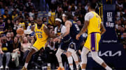 Apr 29, 2024; Denver, Colorado, USA; Los Angeles Lakers forward LeBron James (23) looks to pass to guard D'Angelo Russell (1) as Denver Nuggets guard Kentavious Caldwell-Pope (5) and forward Aaron Gordon (50) defend in the third quarter during game five of the first round for the 2024 NBA playoffs at Ball Arena. Mandatory Credit: Isaiah J. Downing-USA TODAY Sports