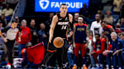 Apr 11, 2025; New Orleans, Louisiana, USA;  Miami Heat guard Tyler Herro (14) brings the ball up court against the New Orleans Pelicans during the first half at Smoothie King Center. Mandatory Credit: Stephen Lew-Imagn Images