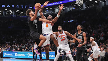 Jan 21, 2025; Brooklyn, New York, USA;  Brooklyn Nets forward Cameron Johnson (2) looks to drive past New York Knicks forward OG Anunoby (8) in the fourth quarter at Barclays Center. Mandatory Credit: Wendell Cruz-Imagn Images