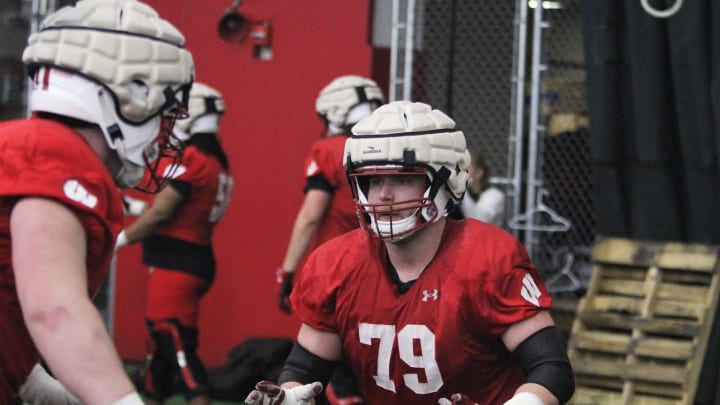 Wisconsin offensive lineman Jack Nelson (79) goes through a drill during spring practice at the McClain Center in Madison, Wisconsin on Tuesday April 2, 2024.