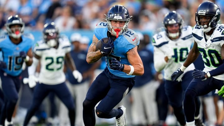 Tennessee Titans wide receiver Mason Kinsey (12) runs the ball against the Seattle Seahawks during the second quarter at Nissan Stadium in Nashville, Tenn., Saturday, Aug. 17, 2024.