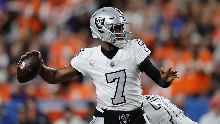 Nov 6, 2025; Denver, Colorado, USA; Las Vegas Raiders quarterback Geno Smith (7) drops back to pass against the Denver Broncos during the first half at Empower Field at Mile High. Mandatory Credit: Isaiah J. Downing-Imagn Images