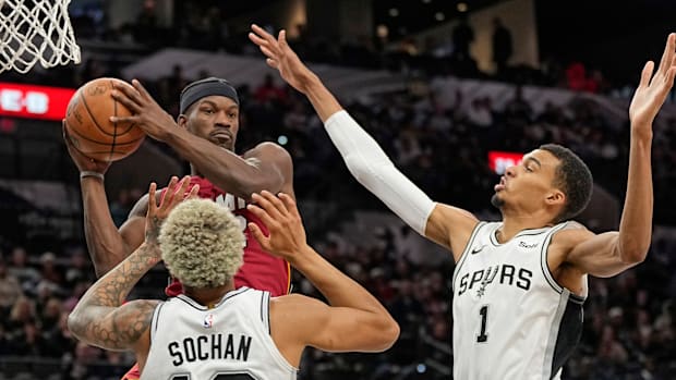 Nov 12, 2023; San Antonio, Texas, USA; Miami Heat forward Jimmy Butler (22) looks to pass the ball while defended by San Anto