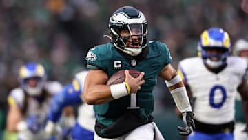 Jan 19, 2025; Philadelphia, Pennsylvania, USA; Philadelphia Eagles quarterback Jalen Hurts (1) runs for a touchdown against the Los Angeles Rams during the first quarter in a 2025 NFC divisional round game at Lincoln Financial Field. Mandatory Credit: Bill Streicher-Imagn Images