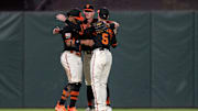 Sep 30, 2023; San Francisco, California, USA; San Francisco Giants center fielder Mike Yastrzemski (5) and San Francisco Giants center fielder Tyler Fitzgerald (49) and San Francisco Giants left fielder Heliot Ramos (12) celebrate after the game against the Los Angeles Dodgers at Oracle Park.