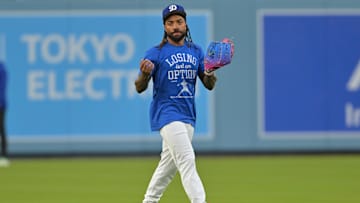 Oct 26, 2025; Los Angeles, CA, USA;  Los Angeles Dodgers center fielder Justin Dean (75) takes ground balls during World Series workouts prior to game three against the Toronto Blue Jays at Dodger Stadium. Mandatory Credit: Jayne Kamin-Oncea-Imagn Images
