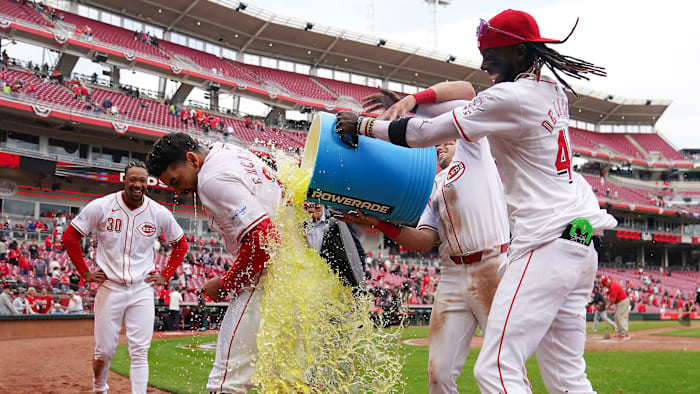 Cincinnati Reds first baseman Christian Encarnacion-Strand (33) is doused by Cincinnati Reds third