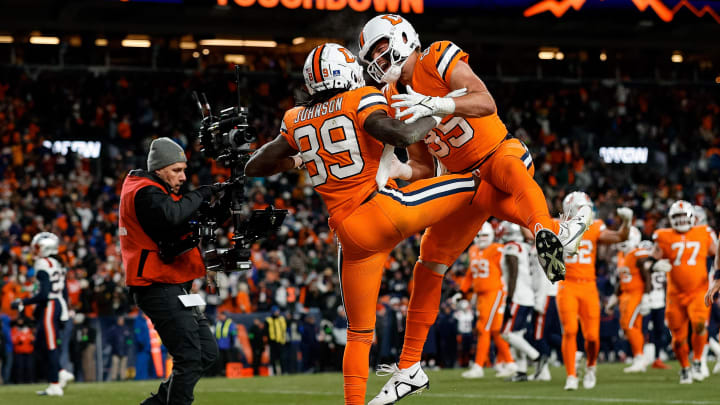 Dec 24, 2023; Denver, Colorado, USA; Denver Broncos wide receiver Brandon Johnson (89) celebrates his touchdown with tight end Lucas Krull (85) in the fourth quarter against the New England Patriots at Empower Field at Mile High. Mandatory Credit: Isaiah J. Downing-USA TODAY Sports