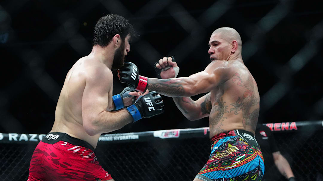 Mar 8, 2025; Las Vegas, Nevada, USA; Alex Pereira (red gloves) fights Magomed Ankalaev (blue gloves) during UFC 313 at T-Mobile Arena. Mandatory Credit: Stephen R. Sylvanie-Imagn Images