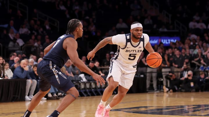 Mar 13, 2024; New York City, NY, USA; Butler Bulldogs guard Posh Alexander (5) controls the ball against Xavier Musketeers guard Quincy Olivari (8) during the second half at Madison Square Garden. Mandatory Credit: Brad Penner-USA TODAY Sports