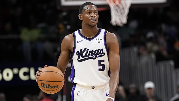 Dec 29, 2023; Atlanta, Georgia, USA; Sacramento Kings guard De'Aaron Fox (5) reacts as he controls the ball against the Atlanta Hawks during the first half at State Farm Arena. Mandatory Credit: Dale Zanine-Imagn Images