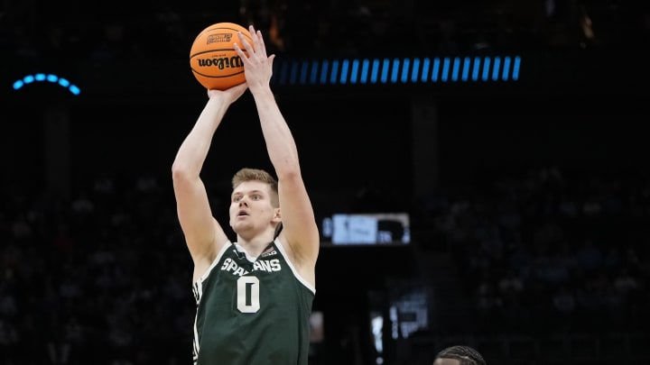March 21, 2024, Charlotte, NC, USA; Michigan State Spartans forward Jaxon Kohler (0) shoots over Mississippi State Bulldogs in the first round of the 2024 NCAA Tournament at the Spectrum Center. Mandatory Credit: Bob Donnan-USA TODAY Sports