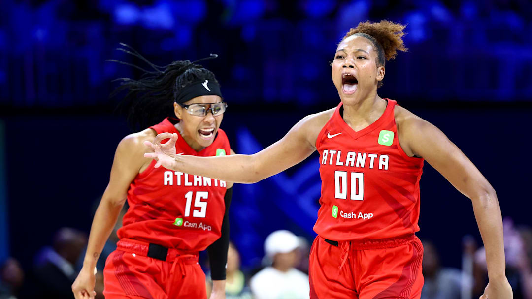 Jul 30, 2025; Arlington, Texas, USA;  Atlanta Dream forward Naz Hillmon (00) celebrates with Atlanta Dream guard Allisha Gray (15) after hitting the game-winning shot against the Dallas Wings during the second half at College Park Center. Mandatory Credit: Kevin Jairaj-Imagn Images