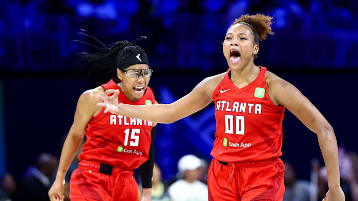Jul 30, 2025; Arlington, Texas, USA;  Atlanta Dream forward Naz Hillmon (00) celebrates with Atlanta Dream guard Allisha Gray (15) after hitting the game-winning shot against the Dallas Wings during the second half at College Park Center. Mandatory Credit: Kevin Jairaj-Imagn Images