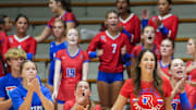 Roncalli volleyball coach Christina Erazmus smiles while watching her team in a match against Carmel in August. The Royals, who won that match, are No. 20 in this week's High School on SI Top 25 Girls Volleyball National Rankings.