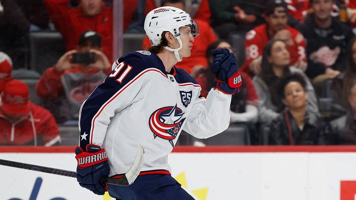 Apr 7, 2026; Detroit, Michigan, USA;  Columbus Blue Jackets center Kent Johnson (91) celebrates after scoring in a shootout against the Detroit Red Wings at Little Caesars Arena. Mandatory Credit: Rick Osentoski-Imagn Images