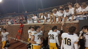 Highland Park players celebrate with fellow students after the Scots' 43-20 win against Dallas Jesuit on Sept. 13, 2024.