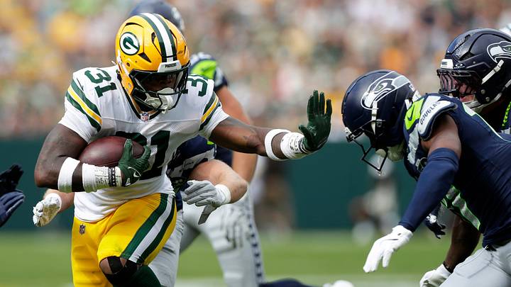 Green Bay Packers running back Emanuel Wilson (31) carries the ball during a preseason game against the Seattle Seahawks on Aug. 23, 2025, at Lambeau Field in Green Bay, Wis. The Packers defeated the Seahawks 20-7.