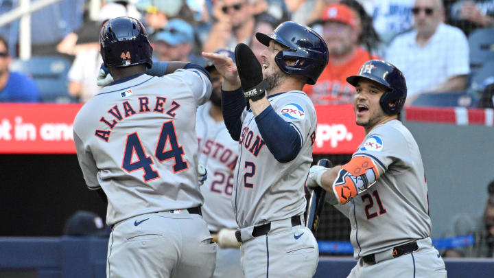 Jul 1, 2024; Toronto, Ontario, CAN;   Houston Astros designated hitter Yordan Alavarez (44) celebrates with third baseman Alex Bregman (2) and catcher Yainer Diaz (21) after hitting a two run home run against the Toronto Blue Jays in the ninth inning at Rogers Centre. Mandatory Credit: Dan Hamilton-USA TODAY Sports