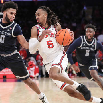 Mar 9, 2024; New York, New York, USA; St. John's Red Storm guard Daniss Jenkins (5) drives past Georgetown Hoyas guard Jayden Epps (10) in the second half at Madison Square Garden. Mandatory Credit: Wendell Cruz-USA TODAY Sports