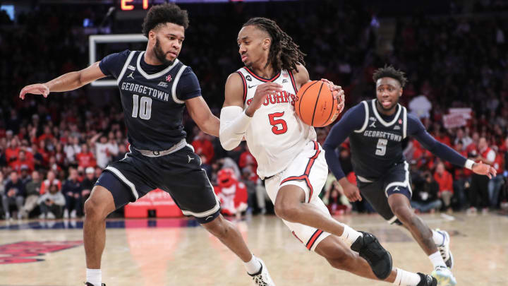Mar 9, 2024; New York, New York, USA; St. John's Red Storm guard Daniss Jenkins (5) drives past Georgetown Hoyas guard Jayden Epps (10) in the second half at Madison Square Garden. Mandatory Credit: Wendell Cruz-USA TODAY Sports