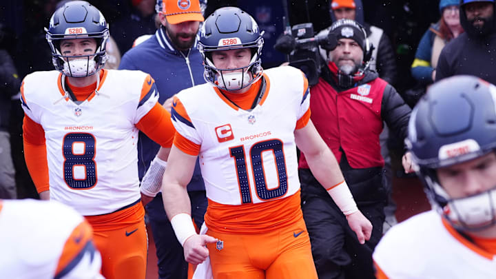 Jan 12, 2025; Orchard Park, New York, USA; Denver Broncos quarterback Jarrett Stidham (8) and quarterback Bo Nix (10) warm up before a game against the Buffalo Bills in an AFC wild card game at Highmark Stadium. Jan 12, 2025; Orchard Park, New York, USA; Denver Broncos quarterback Jarrett Stidham (8) and quarterback Bo Nix (10) warm up before a game against the Buffalo Bills in an AFC wild card game at Highmark Stadium.