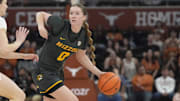 Jan 30, 2025; Austin, Texas, USA; Missouri Tigers guard Grace Slaughter (0) looks to pass the ball while defended by Texas Longhorns guard Shay Holle (10) during the second half at Moody Center. Mandatory Credit: Scott Wachter-Imagn Images
