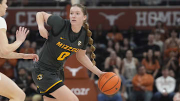 Jan 30, 2025; Austin, Texas, USA; Missouri Tigers guard Grace Slaughter (0) looks to pass the ball while defended by Texas Longhorns guard Shay Holle (10) during the second half at Moody Center. Mandatory Credit: Scott Wachter-Imagn Images