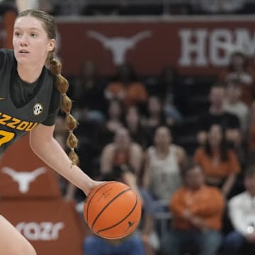 Jan 30, 2025; Austin, Texas, USA; Missouri Tigers guard Grace Slaughter (0) looks to pass the ball while defended by Texas Longhorns guard Shay Holle (10) during the second half at Moody Center. Mandatory Credit: Scott Wachter-Imagn Images