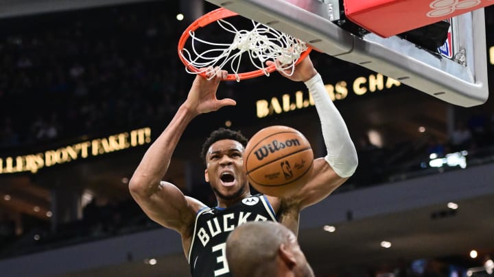 Milwaukee Bucks forward Giannis Antetokounmpo (34) dunks the ball in the first quarter against the Boston Celtics at Fiserv Forum. 