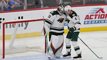 Oct 22, 2024; Sunrise, Florida, USA; Minnesota Wild goaltender Filip Gustavsson (32) celebrates with defenseman Jon Merrill (4) after the game against the Florida Panthers at Amerant Bank Arena. Mandatory Credit: Sam Navarro-Imagn Images