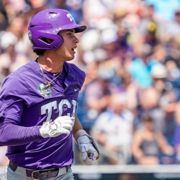 Jun 18, 2023; Omaha, NE, USA;  TCU Horned Frogs shortstop Anthony Silva (5) runs to first after hitting a single against the Virginia Cavaliers during the sixth inning at Charles Schwab Field Omaha. Mandatory Credit: Dylan Widger-USA TODAY Sports