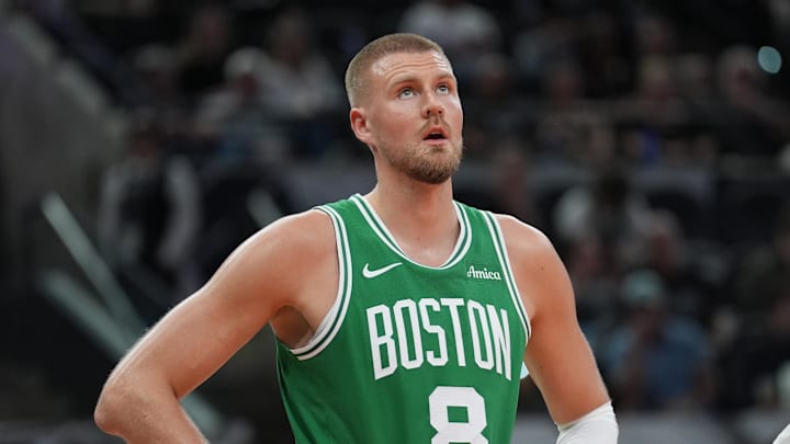 Boston Celtics center Kristaps Porzingis stands on the court.