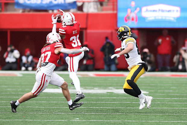 Nebraska Cornhuskers defensive back Tommi Hill intercepts a pass intended for Iowa Hawkeyes wide receiver Nico Ragaini