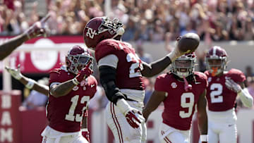 Oct 12, 2024; Tuscaloosa, Alabama, USA;  Alabama Crimson Tide defensive lineman LT Overton (22) celebrates after recovering a South Carolina fumble at Bryant-Denny Stadium. Alabama defeated South Carolina 27-25. Mandatory Credit: Gary Cosby Jr.-Imagn Images