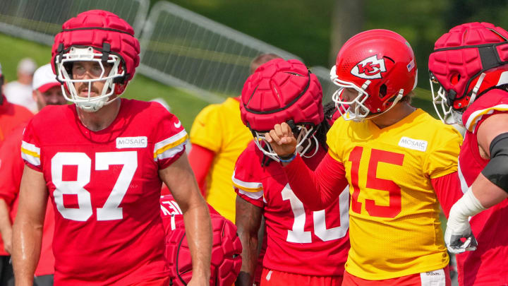 Jul 22, 2024; St. Joseph, MO, USA; Kansas City Chiefs quarterback Patrick Mahomes (15) talks with tight end Travis Kelce (87) and running back Isiah Pacheco (10) in a huddle during training camp at Missouri Western State University. Mandatory Credit: Denny Medley-USA TODAY Sports