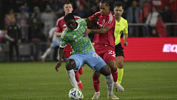 Seattle Sounders FC forward Georgi Minoungou (93) and St. Louis CITY SC midfielder Akil Watts (20) battle for the ball 