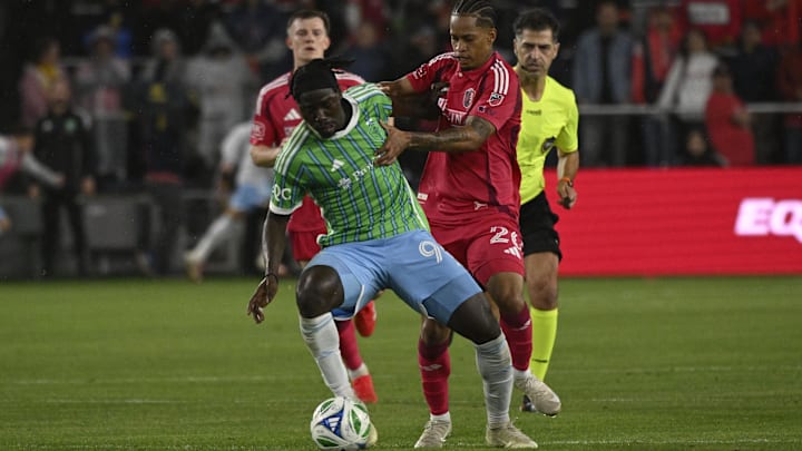 Seattle Sounders FC forward Georgi Minoungou (93) and St. Louis CITY SC midfielder Akil Watts (20) battle for the ball 