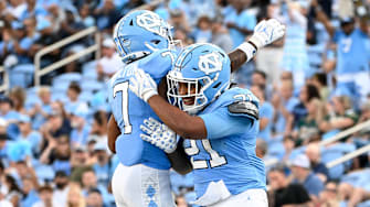 Sep 7, 2024; Chapel Hill, North Carolina, USA; North Carolina Tar Heels running back Davion Gause (21) celebrates with wide receiver Christian Hamilton (7) after scoring a touchdown in the fourth quarter at Kenan Memorial Stadium.