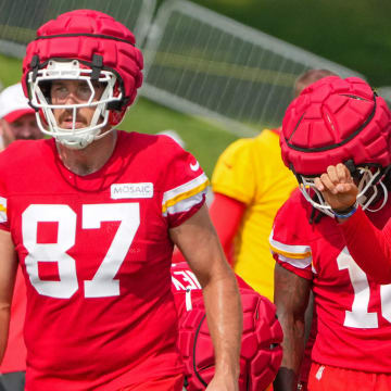 Jul 22, 2024; St. Joseph, MO, USA; Kansas City Chiefs quarterback Patrick Mahomes (15) talks with tight end Travis Kelce (87) and running back Isiah Pacheco (10) in a huddle during training camp at Missouri Western State University. Mandatory Credit: Denny Medley-USA TODAY Sports