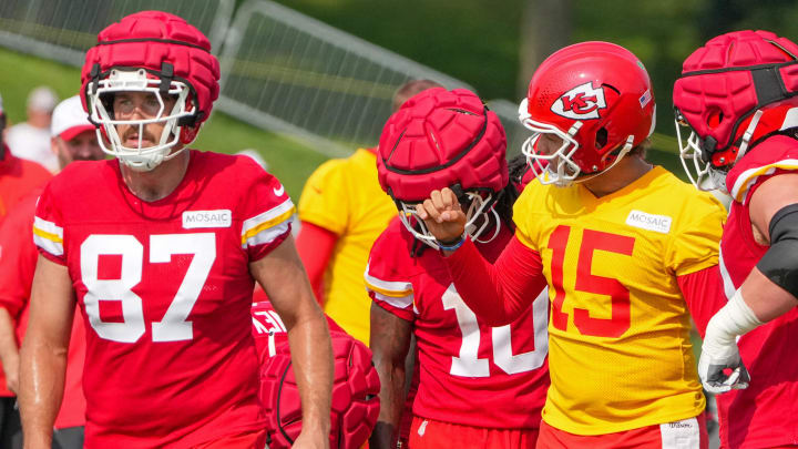 Jul 22, 2024; St. Joseph, MO, USA; Kansas City Chiefs quarterback Patrick Mahomes (15) talks with tight end Travis Kelce (87) and running back Isiah Pacheco (10) in a huddle during training camp at Missouri Western State University. Mandatory Credit: Denny Medley-USA TODAY Sports