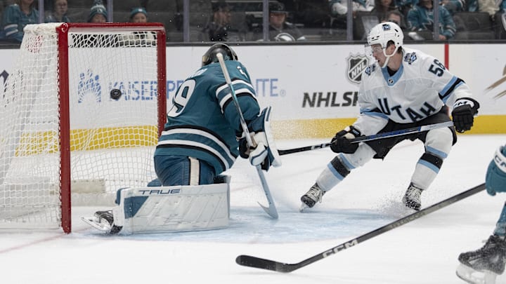 Oct 1, 2024; San Jose, California, USA;  Utah Hockey Club forward Kailer Yamamoto (56) shoots the puck past San Jose Sharks goaltender Mackenzie Blackwood (29) during the third period at SAP Center at San Jose. Mandatory Credit: Stan Szeto-Imagn Images
