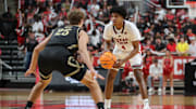 Nov 4, 2025; Lubbock, Texas, USA; Texas Tech Red Raiders guard Christian Anderson (4) dribbles the ball against Lindenwood Lions forward Todd Bieg (25) in the second half at United Supermarkets Arena. Mandatory Credit: Michael C. Johnson-Imagn Images