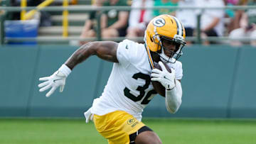 Green Bay Packers running back MarShawn Lloyd (32) runs through a drill during the second day of training camp on Thursday, July 24, 2025, at Ray Nitschke Field in Ashwaubenon, Wis.