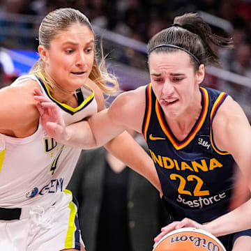 Indiana Fever guard Caitlin Clark (22) rushes up the court against Dallas Wings guard Jacy Sheldon (4) on Sunday, Sept. 15, 2024, during the game at Gainbridge Fieldhouse in Indianapolis. The Indiana Fever defeated the Dallas Wings, 110-109.