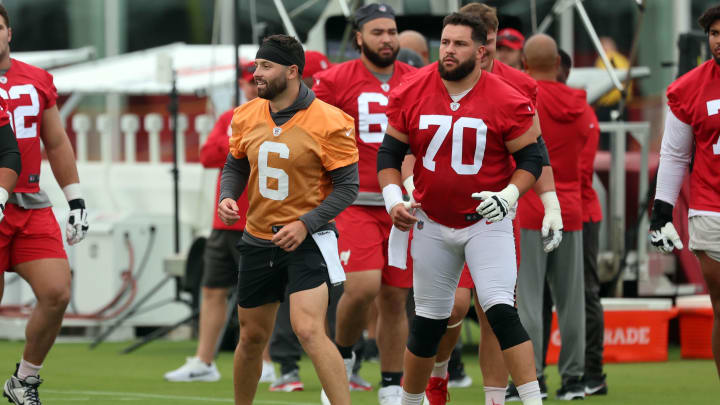 Jul 25, 2024; Tampa, FL, USA;  Tampa Bay Buccaneers quarterback Baker Mayfield (6), center Robert Hainsey (70) work out during training camp at AdventHealth Training Center. Mandatory Credit: Kim Klement Neitzel-USA TODAY Sports