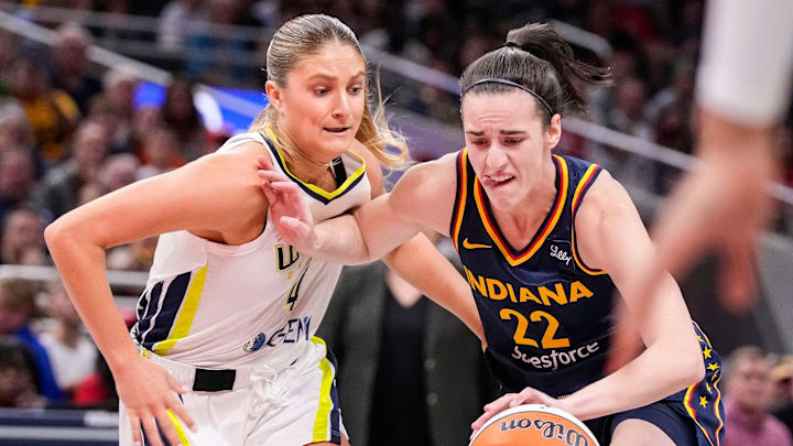 Indiana Fever guard Caitlin Clark (22) rushes up the court against Dallas Wings guard Jacy Sheldon (4) on Sunday, Sept. 15, 2024, during the game at Gainbridge Fieldhouse in Indianapolis. The Indiana Fever defeated the Dallas Wings, 110-109.